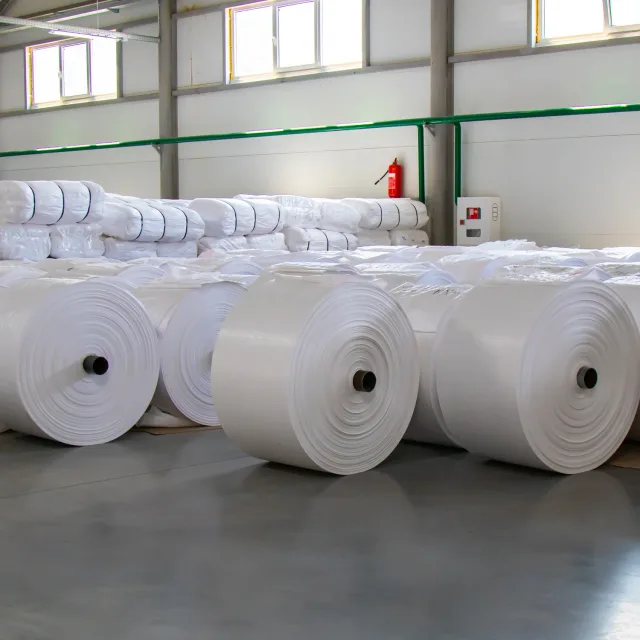 Fabric rolls arranged in a textile production facility